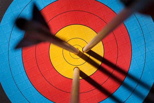 Three arrows on an archery target symbolising effective psychotherapy