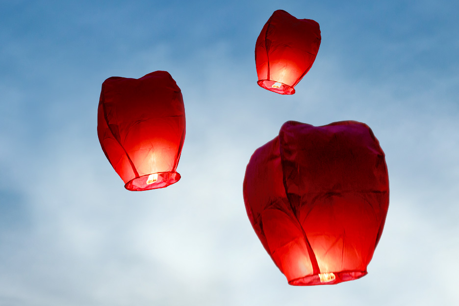 Three red lanterns in the sky symbolising effective pain management