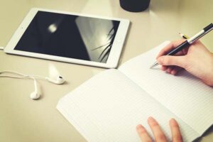 Photo of person writing note