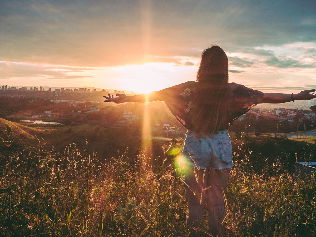 Woman looking at sunset