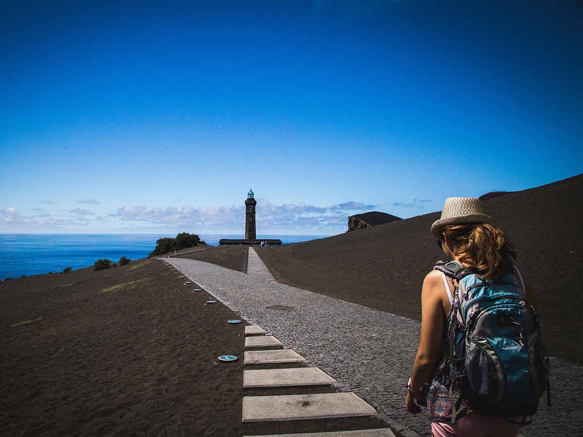 Woman walking on a coastal route