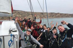Young people and staff of Ocean Youth Trust South on a boat named "Prolific"