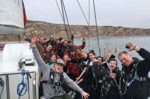 Young people and staff of Ocean Youth Trust South on a boat named "Prolific"