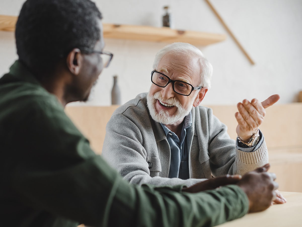 Two older gentlemen chatting informally