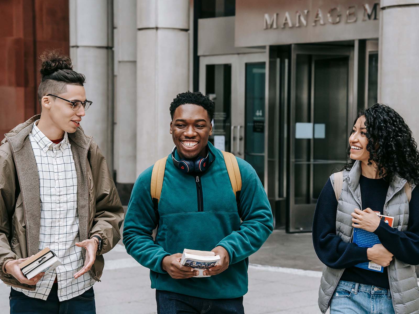 Photo of three happy university students